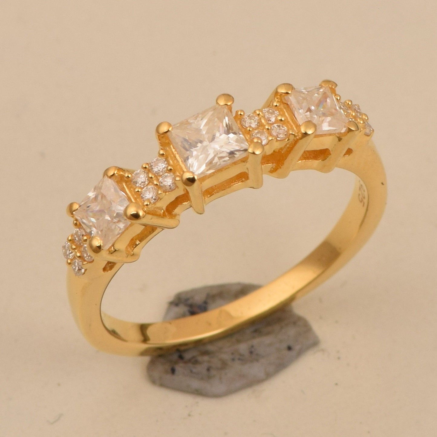 Pricess cut moissanite half eternity gold ring